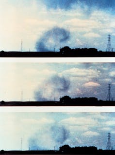 The wind curls over a farmhouse after hitting the ground.