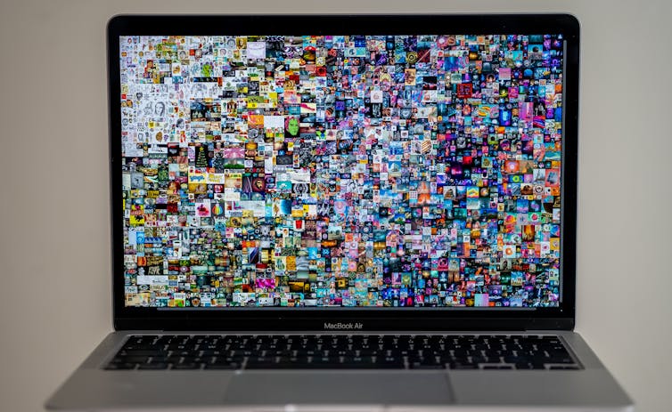 A work of art appears on a laptop screen.