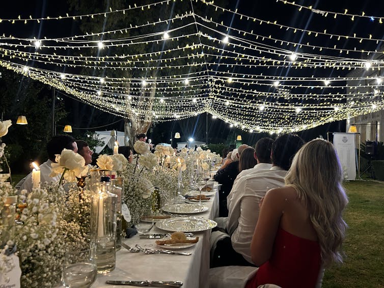 A wedding venue laid out with a table and lights