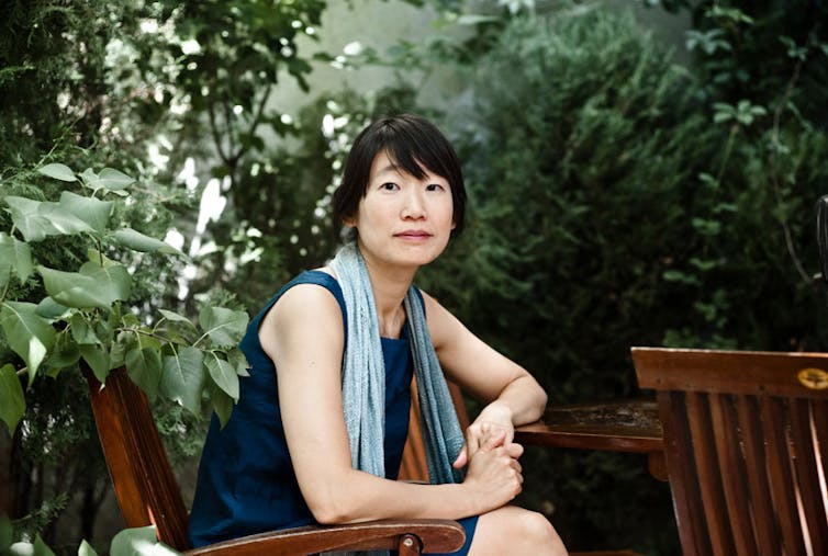 Madeleine Thien in a garden.