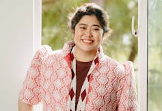 A photo of a young smiling Asian woman