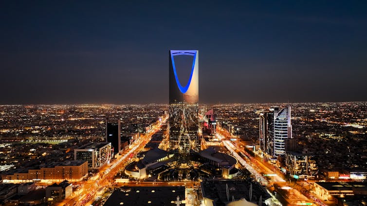 A city skyline seen at night.