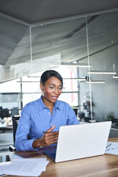 Woman conducting job interview on laptop
